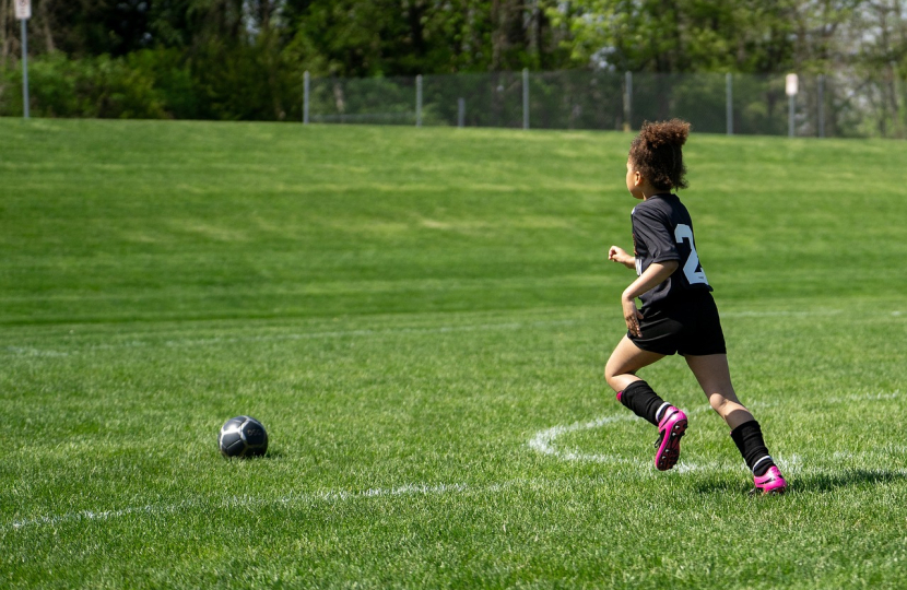 image of a child playing football from Pixabay